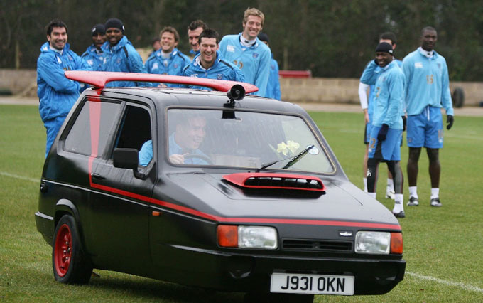 The Portsmouth players, including Hughes (left on the left), laughed at teammate Sean Davis, who was driving the Reliant Robin inspired by A-Te in a training session in 2008